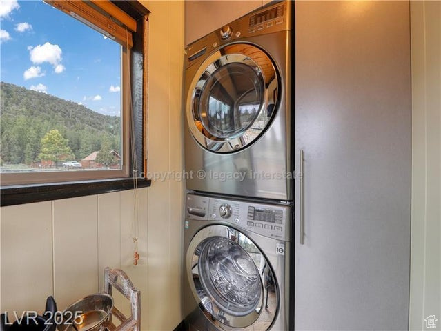 Clothes washing area with stacked washer / dryer
