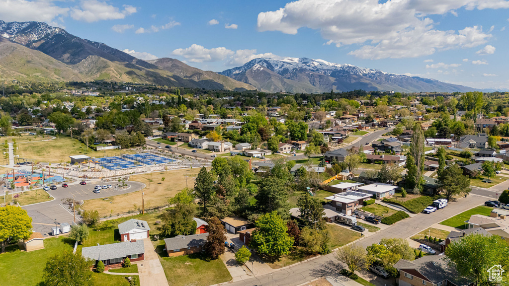 Birds eye view of property with a residential view and a mountain view