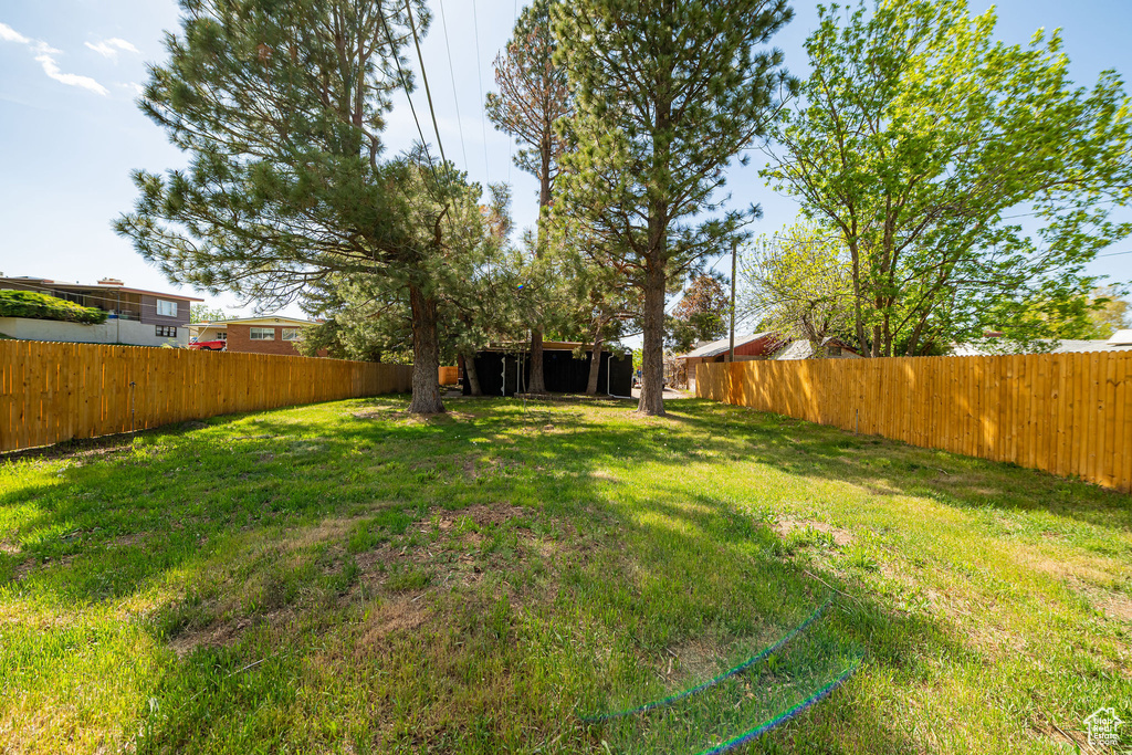 View of yard with a fenced backyard