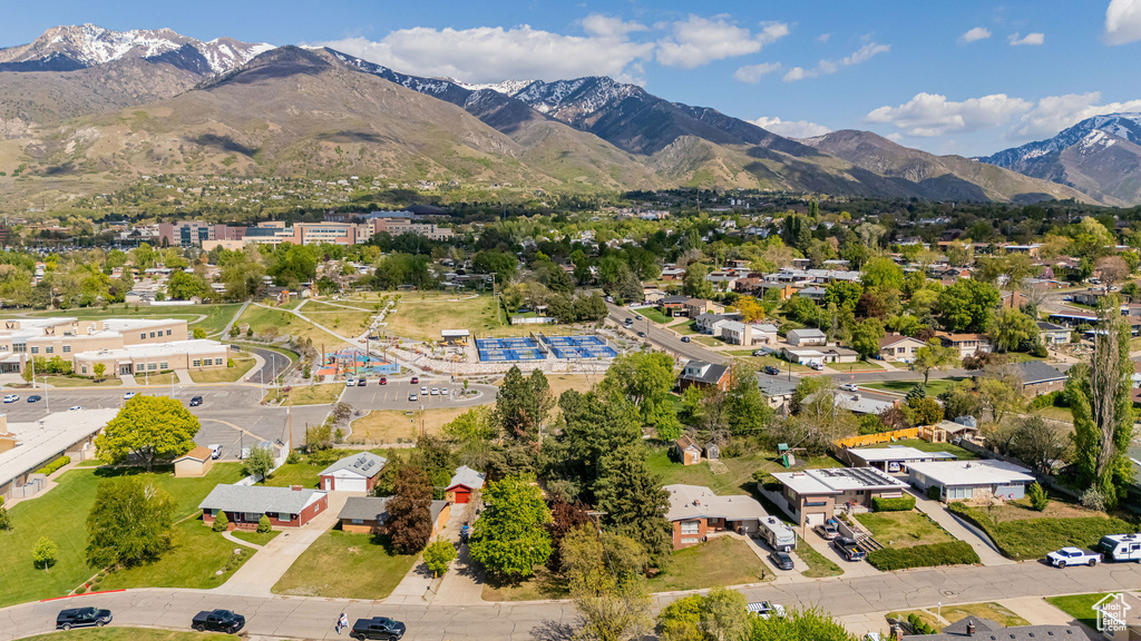 Birds eye view of property with a residential view and a mountain view
