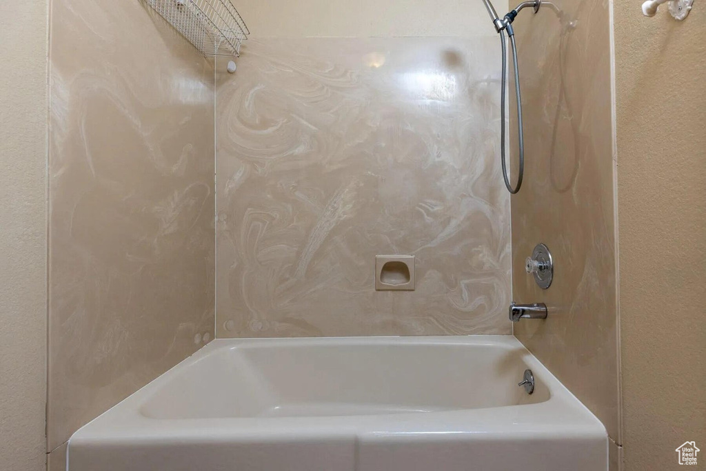 Bathroom featuring shower / washtub combination