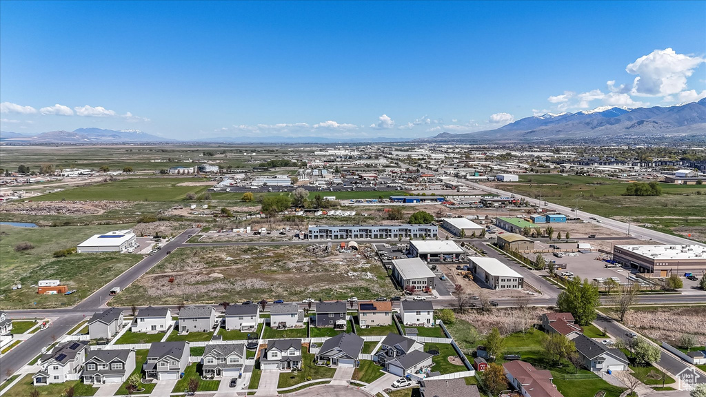 Birds eye view of property with a residential view and a mountain view