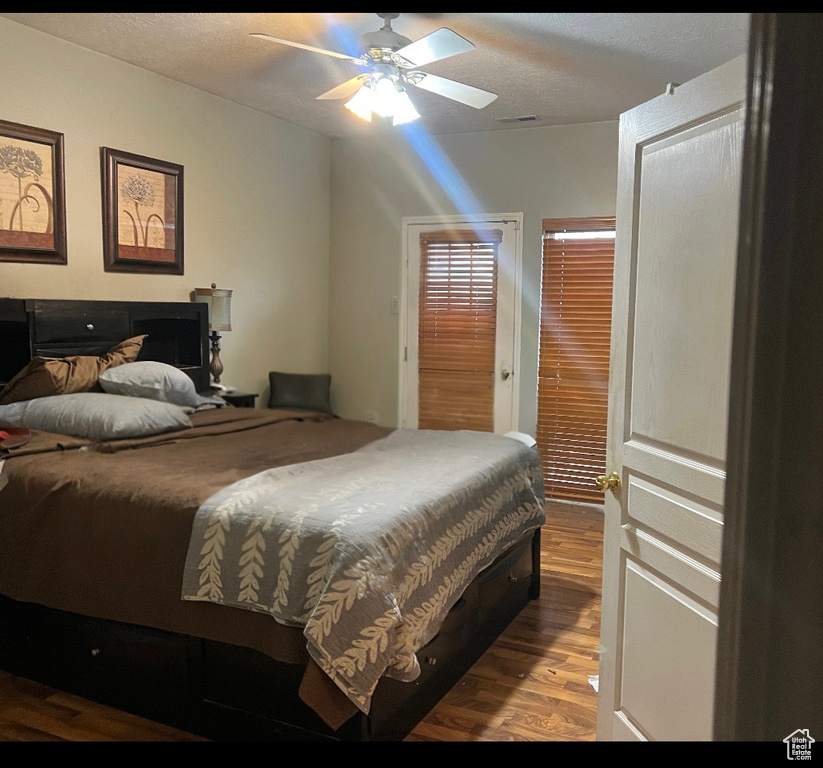 Bedroom featuring ceiling fan and wood finished floors
