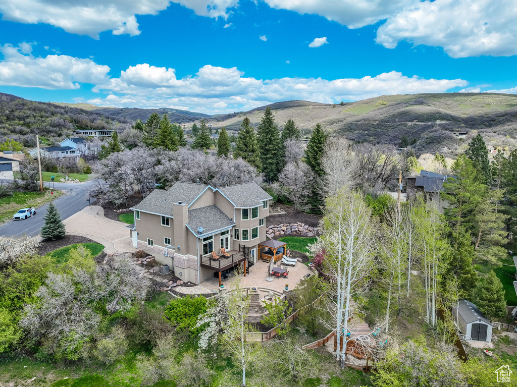 Birds eye view of property featuring a mountain view