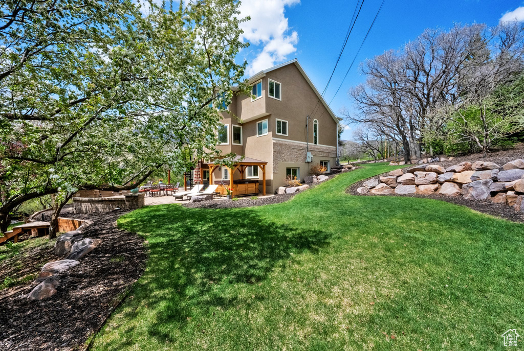 View of yard with a patio area