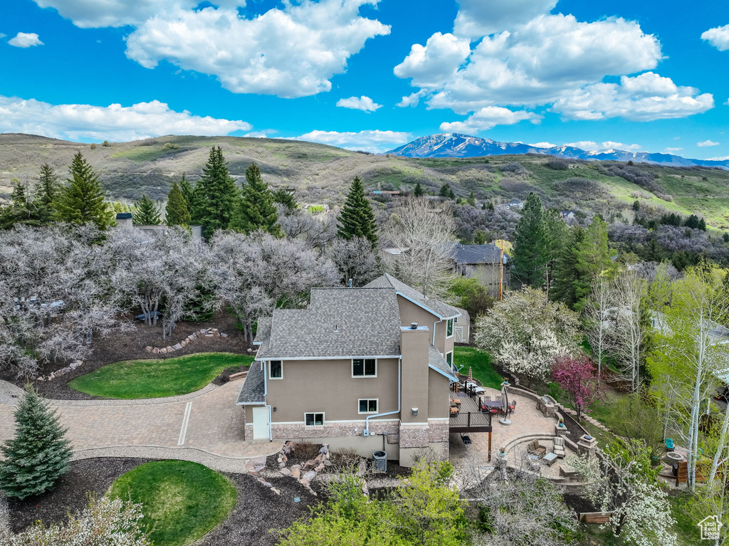 Birds eye view of property with a mountain view