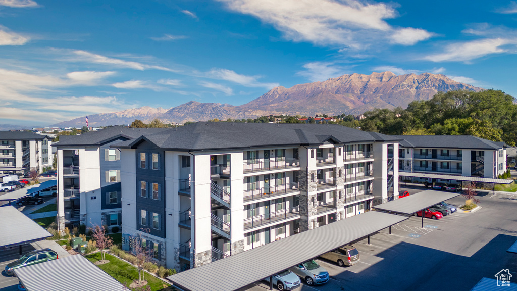 Exterior space with a parking lot and a mountain view
