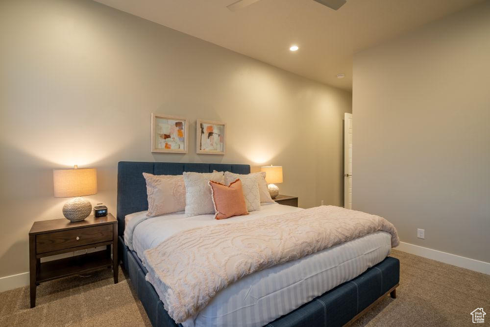 Carpeted bedroom featuring recessed lighting and baseboards