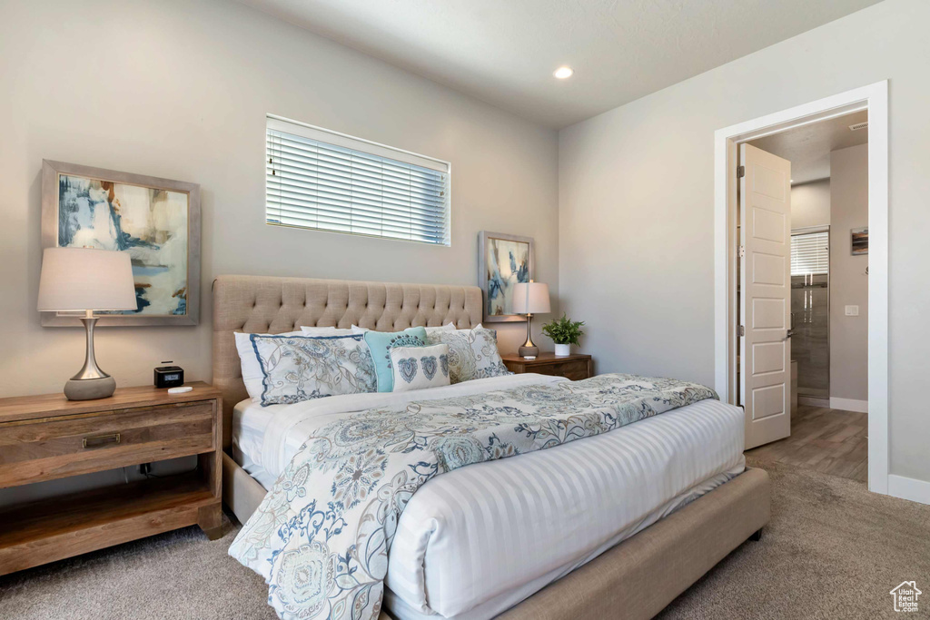 Carpeted bedroom with baseboards and recessed lighting