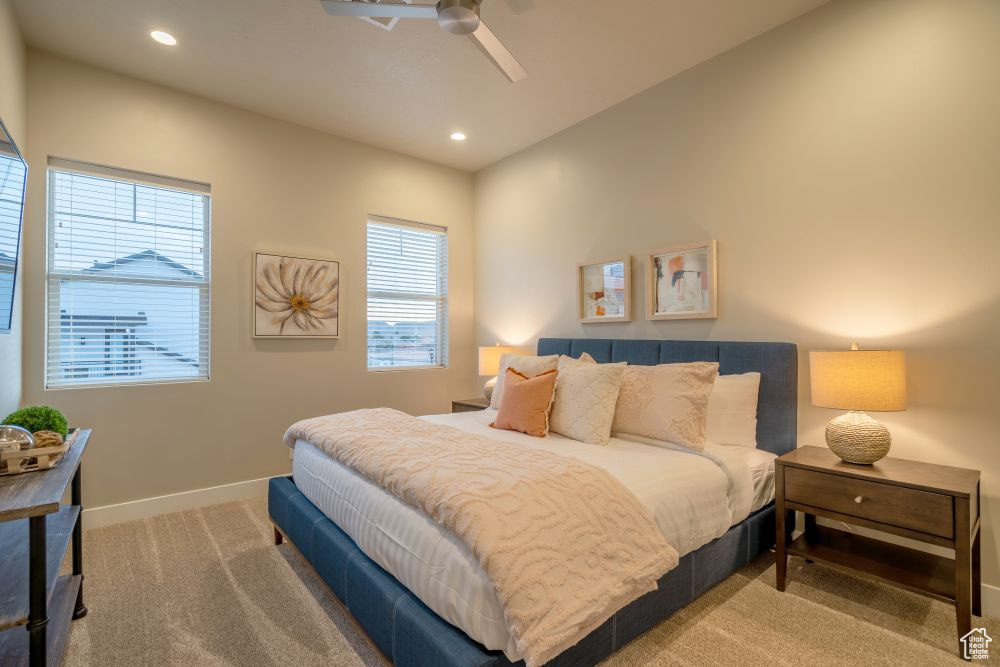 Carpeted bedroom with recessed lighting, baseboards, and a ceiling fan
