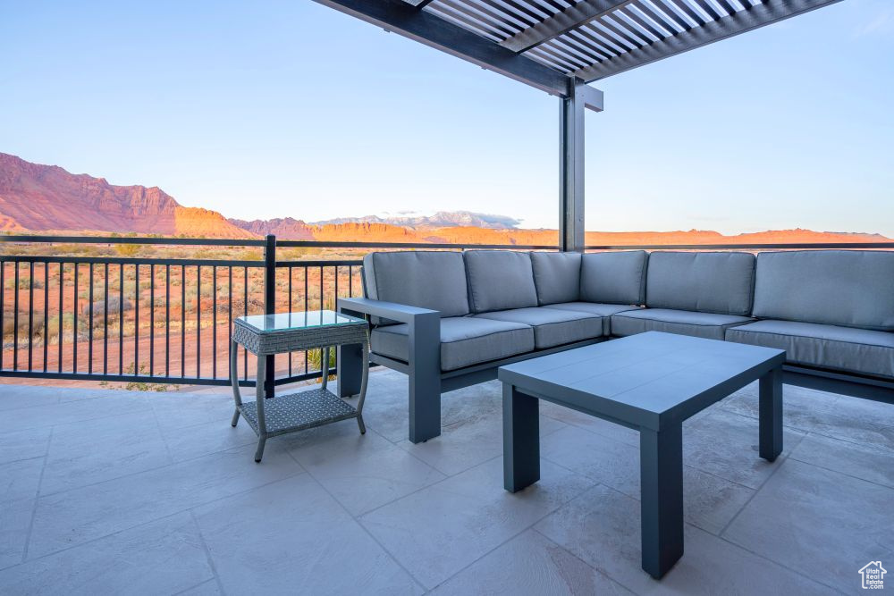 View of patio / terrace with a pergola, a mountain view, and outdoor lounge area