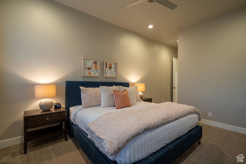 Carpeted bedroom with recessed lighting, a ceiling fan, and baseboards