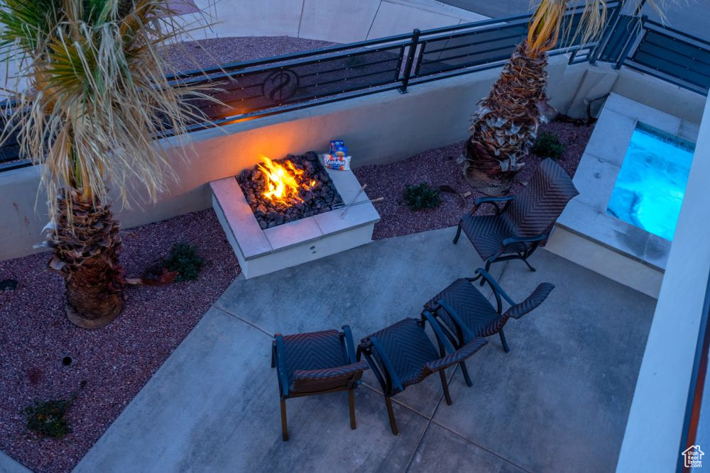 View of patio featuring an outdoor fire pit