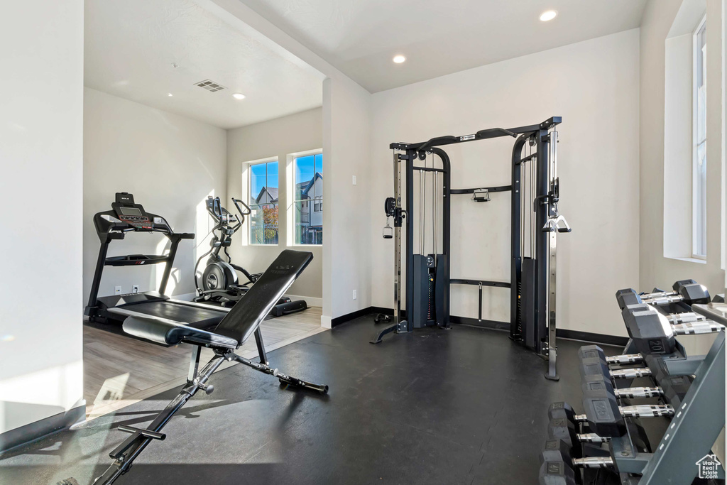 Gym featuring baseboards and recessed lighting