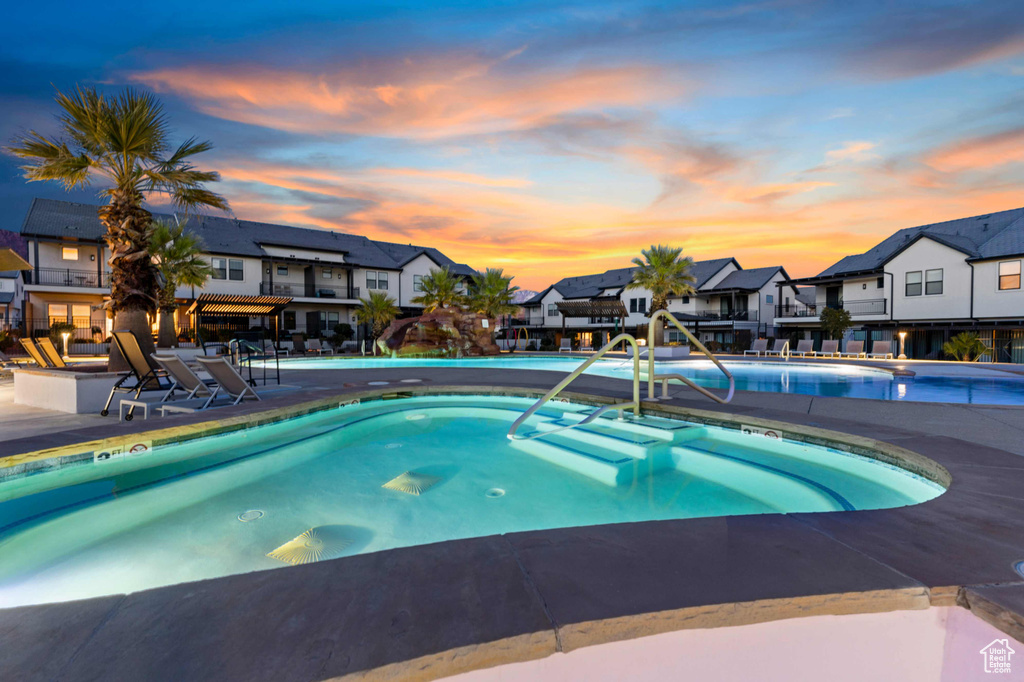 Community pool featuring a residential view and a patio area