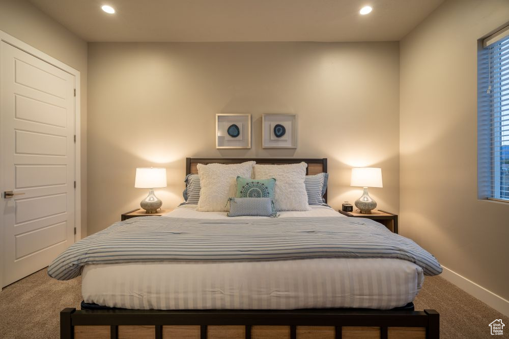 Bedroom featuring baseboards, carpet, and recessed lighting
