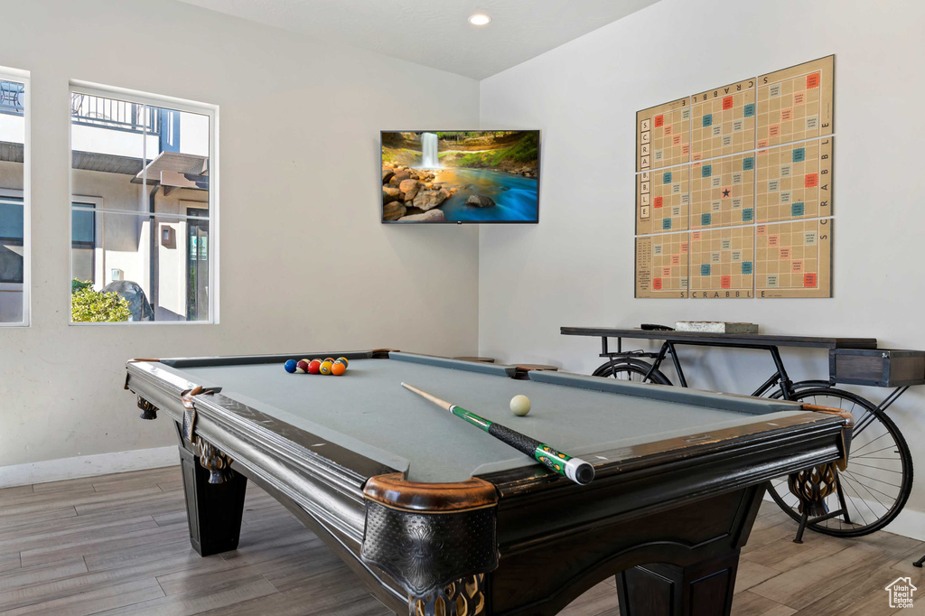 Game room with wood finished floors, baseboards, billiards, and recessed lighting