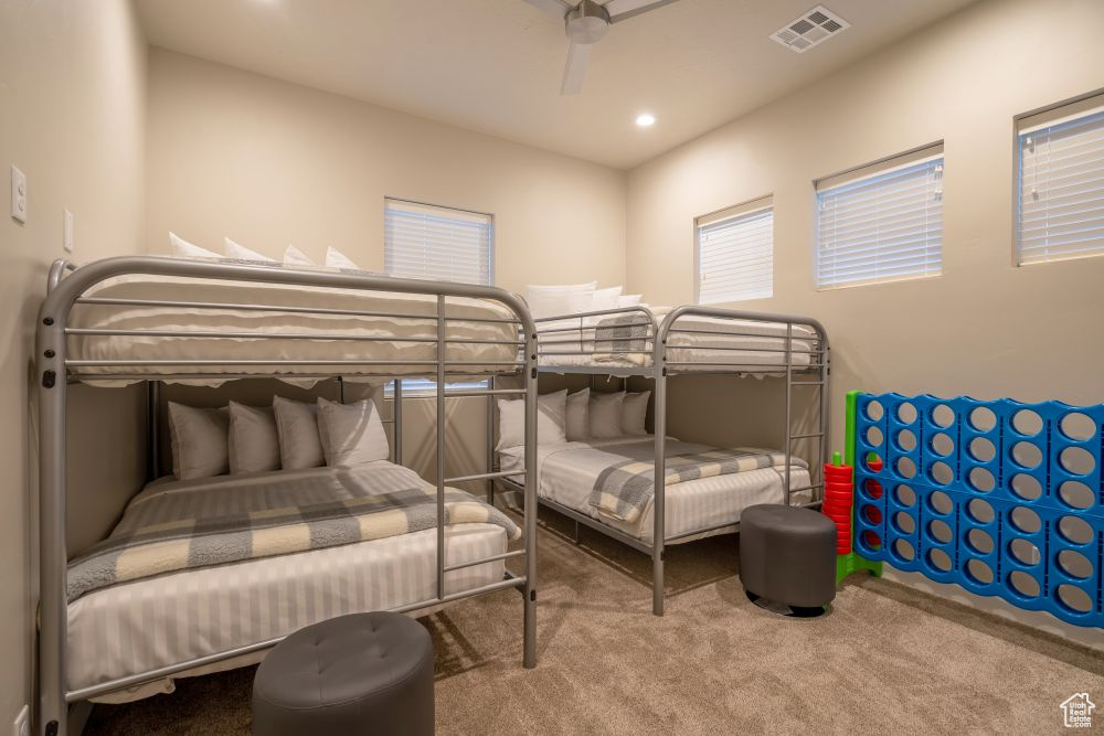 Bedroom with visible vents, recessed lighting, carpet, and ceiling fan