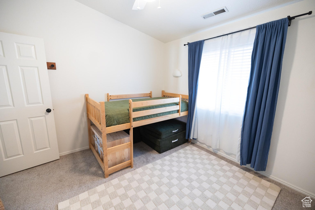 Bedroom with baseboards and visible vents