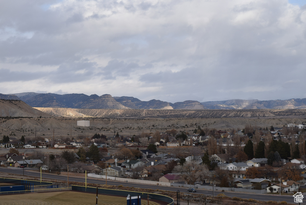 Property view of mountains featuring a residential view