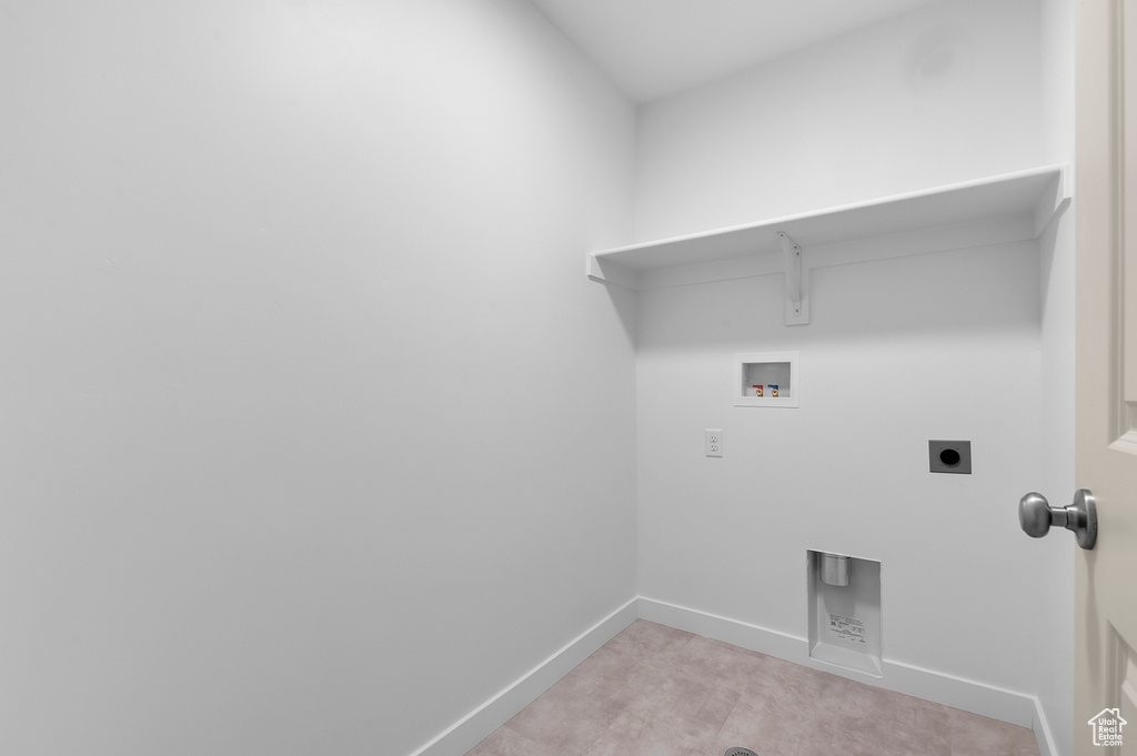 Laundry area featuring laundry area, electric dryer hookup, baseboards, and hookup for a washing machine