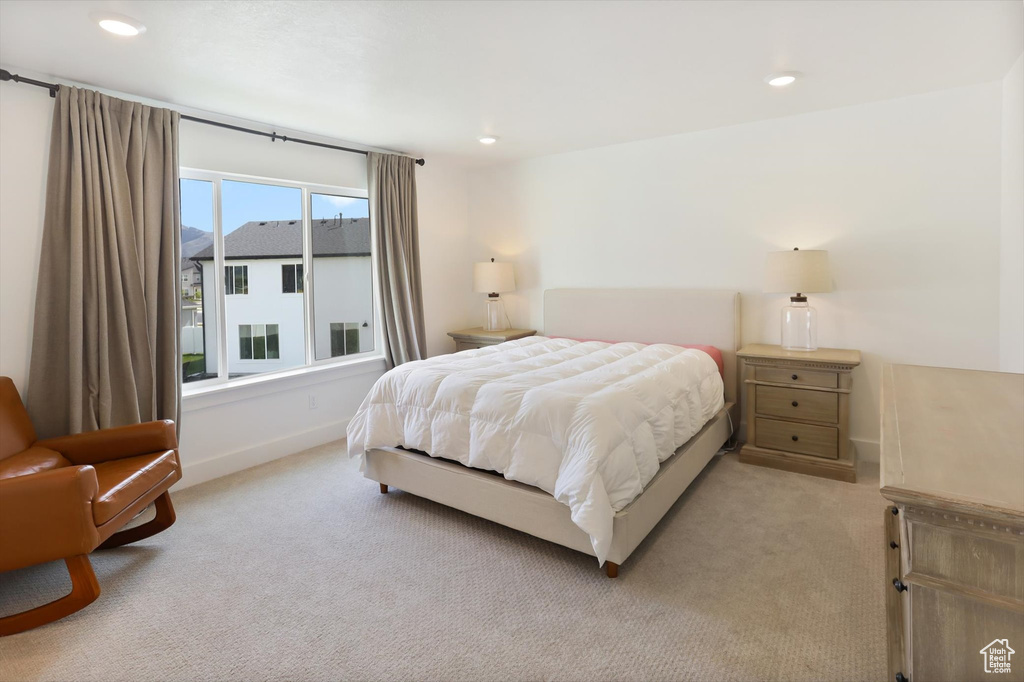 Bedroom featuring recessed lighting, baseboards, and light carpet