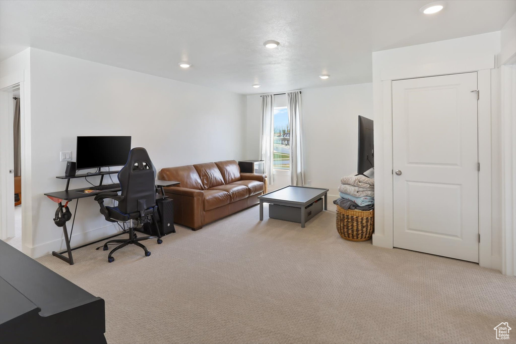 Office space with carpet flooring and recessed lighting