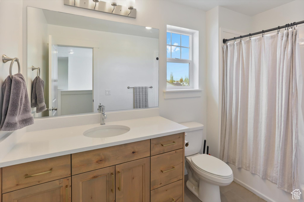 Bathroom featuring vanity and toilet