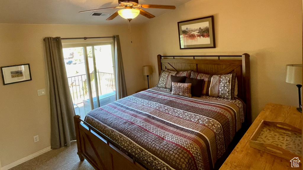 Bedroom with ceiling fan, carpet floors, access to exterior, baseboards, and visible vents
