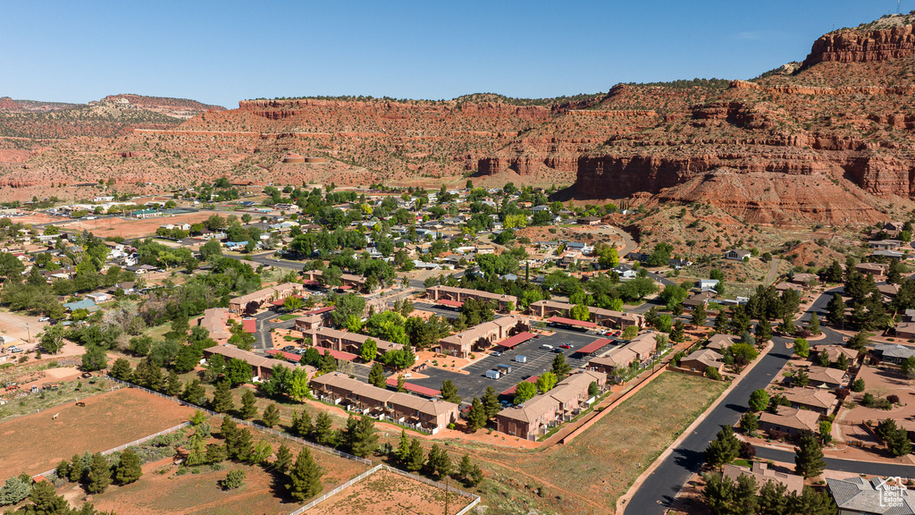 Aerial view of property's location with a mountainous background