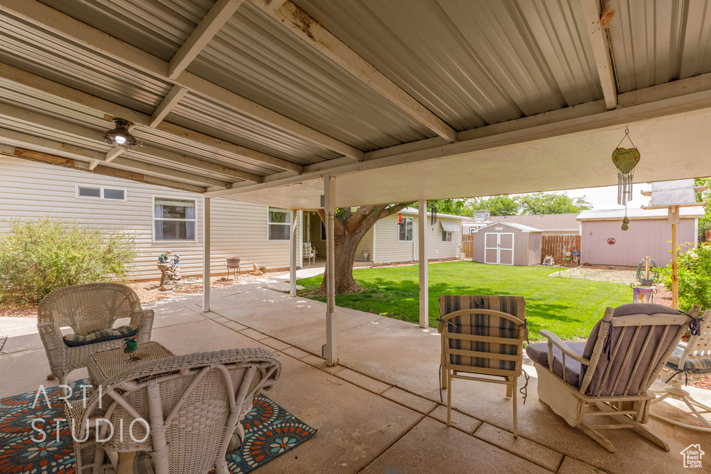 View of patio / terrace with a storage shed and an outbuilding
