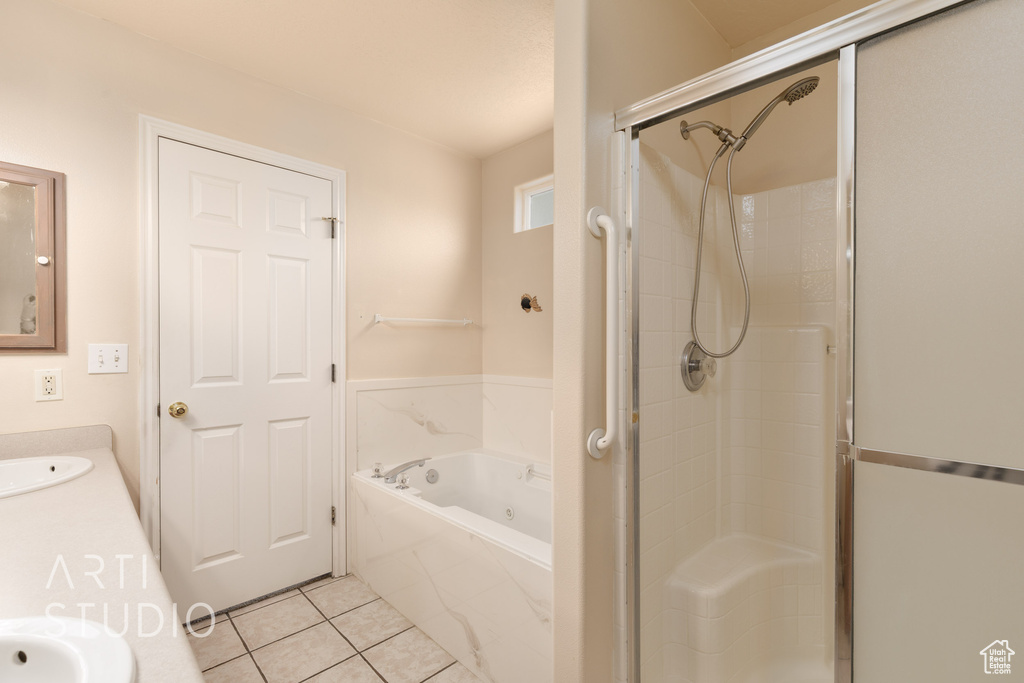 Full bath with a garden tub, tile patterned flooring, a stall shower, and vanity