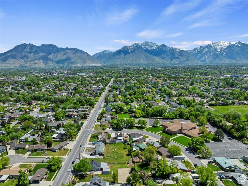 Aerial perspective of suburban area featuring a mountainous background