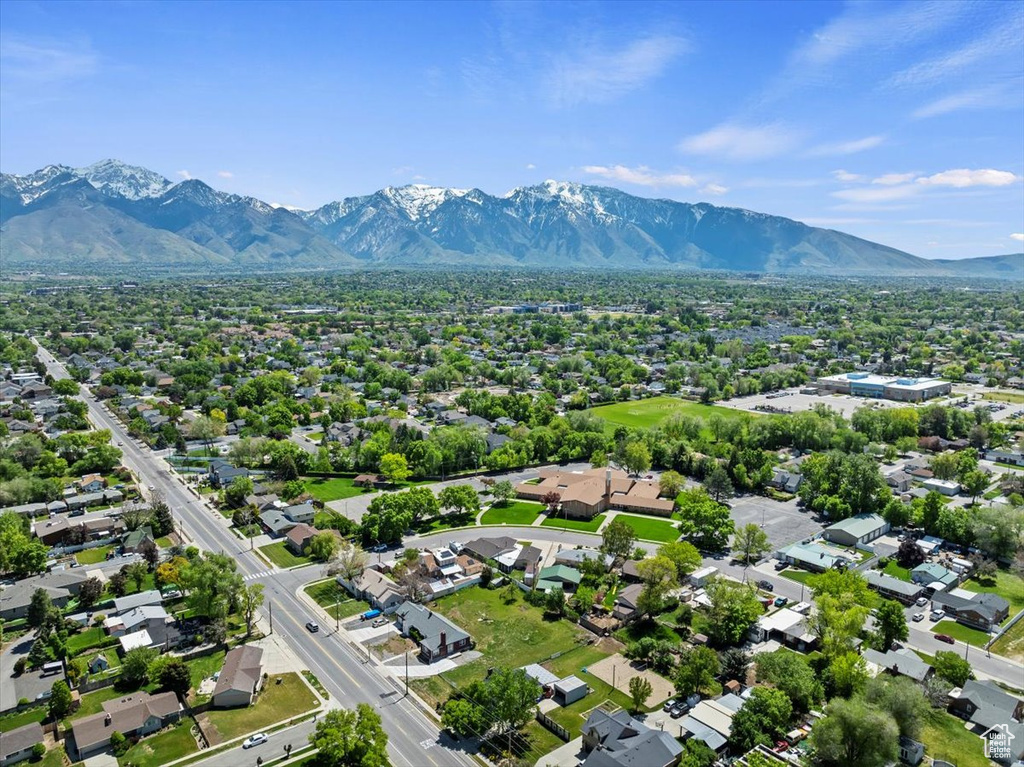 Aerial perspective of suburban area featuring a mountain backdrop