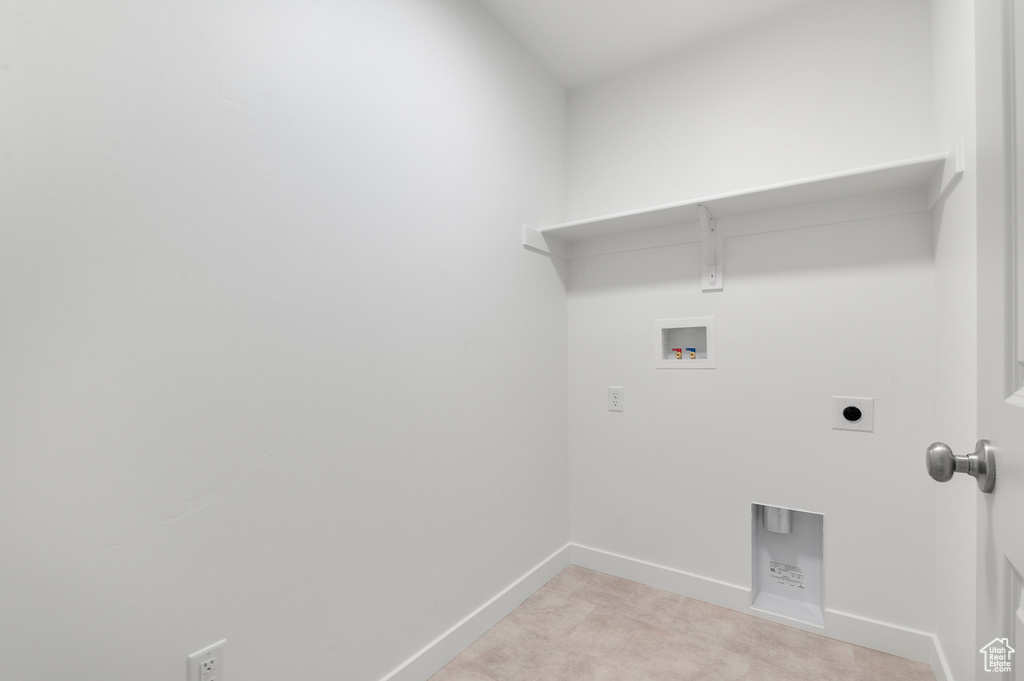Laundry area featuring washer hookup, laundry area, light colored carpet, baseboards, and hookup for an electric dryer