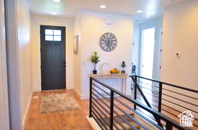 Foyer featuring baseboards, recessed lighting, and wood finished floors