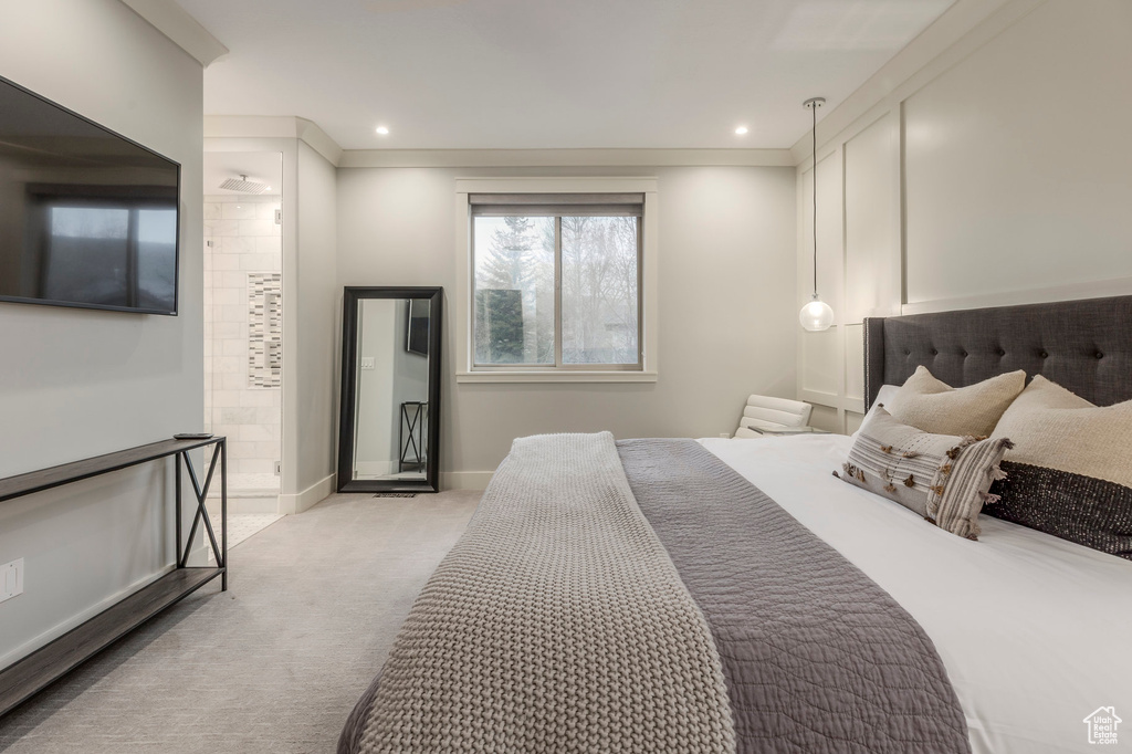 Bedroom featuring ensuite bathroom, carpet flooring, baseboards, and recessed lighting