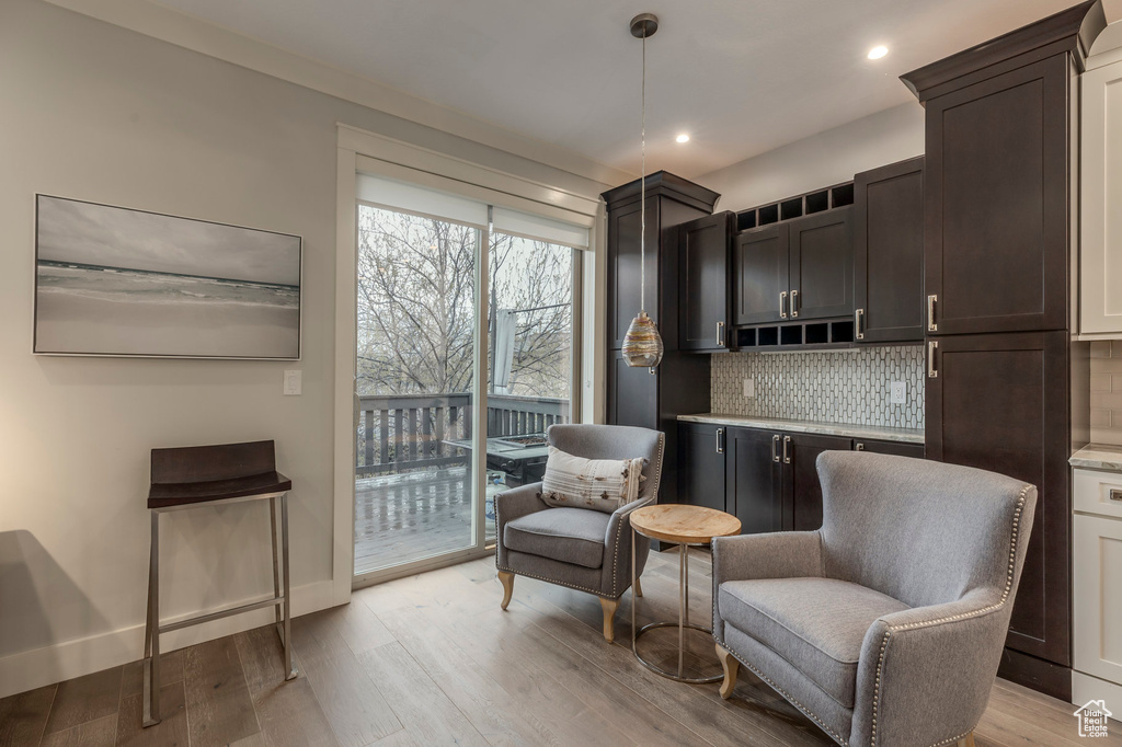 Living area featuring recessed lighting and light wood finished floors