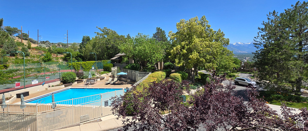 Community pool featuring a patio area
