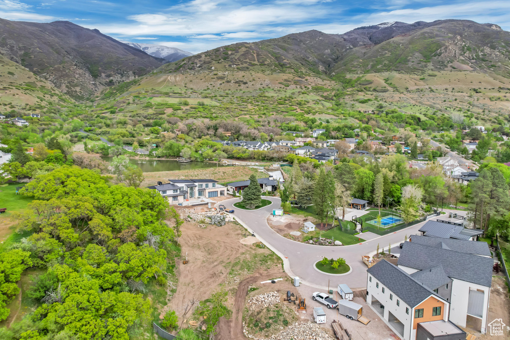 Birds eye view of property with a mountain view