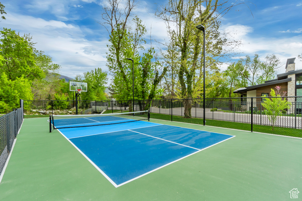 View of sport court featuring fence