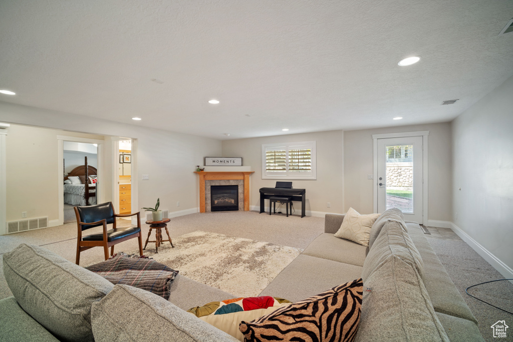 Living room with carpet and recessed lighting