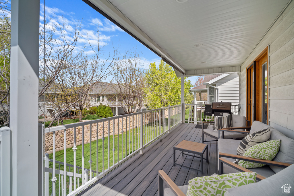 Wooden deck featuring covered porch