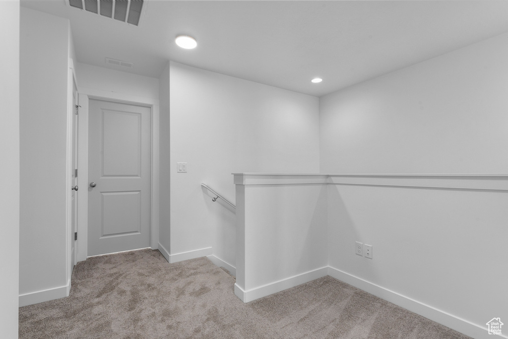 Spacious closet with visible vents and carpet