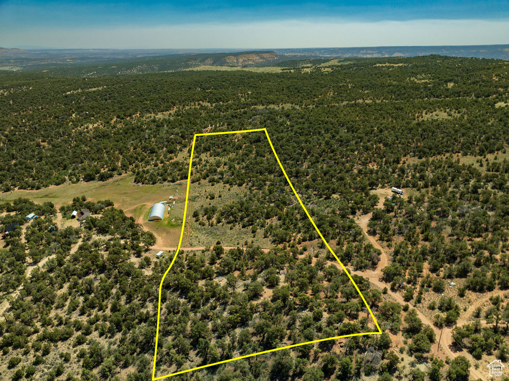 Aerial view of property and surrounding area with property parcel outlined
