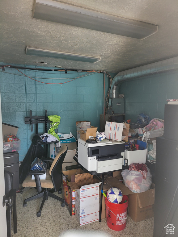 Garage featuring concrete block wall