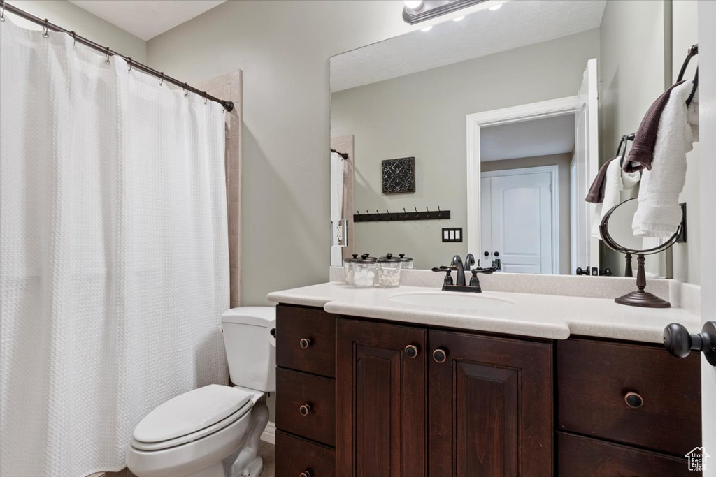 Bathroom with toilet and vanity