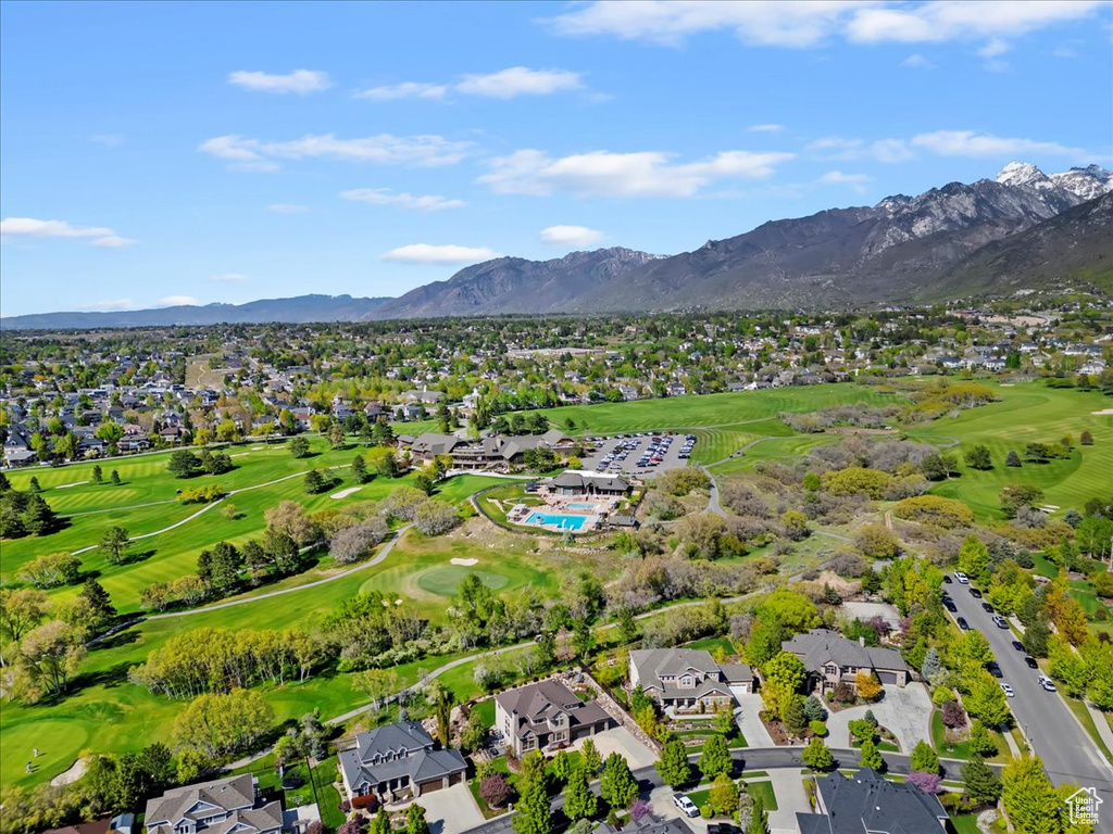 Birds eye view of property with a residential view and a mountain view