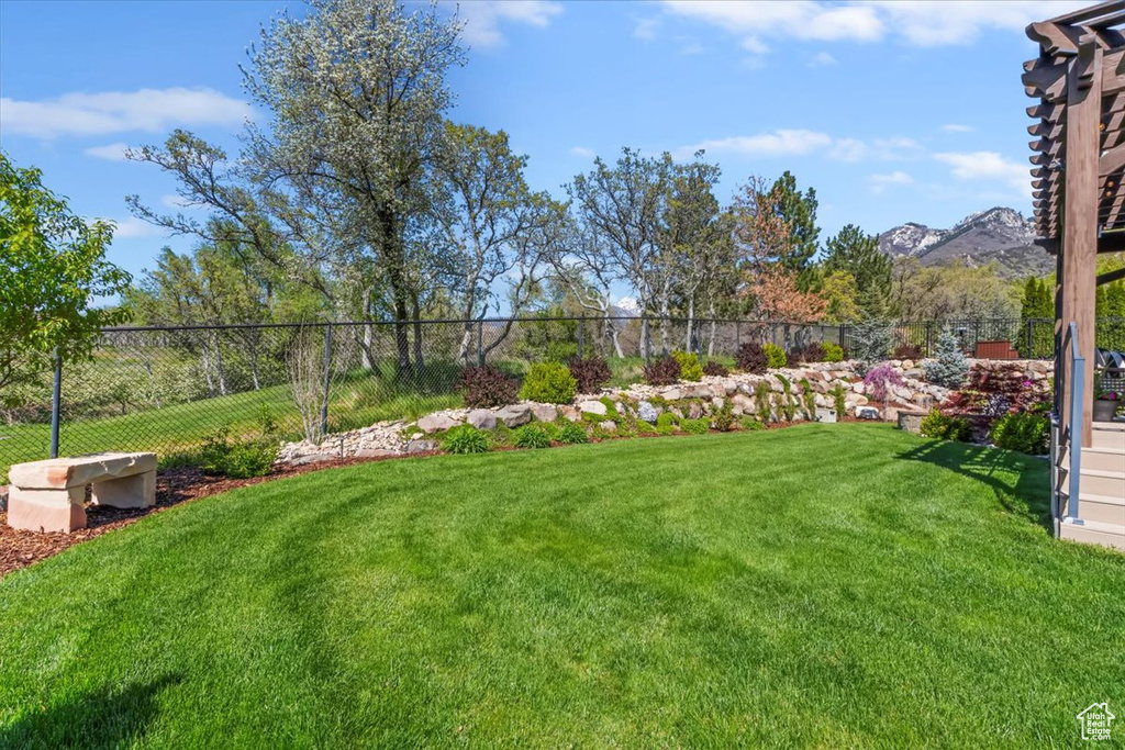 View of yard featuring fence