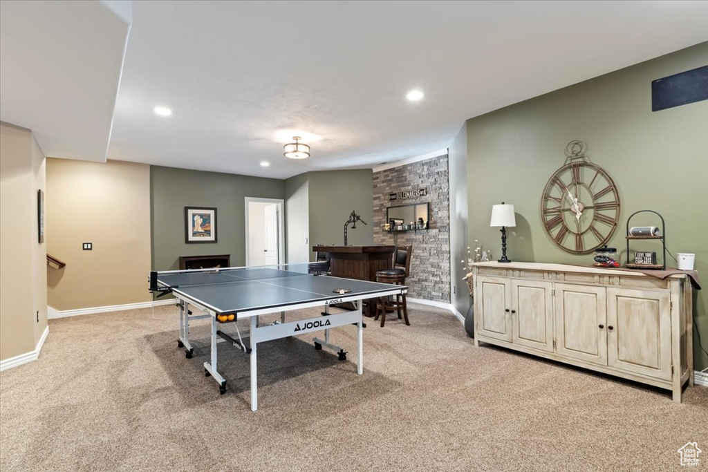 Game room with indoor bar, recessed lighting, baseboards, and light colored carpet